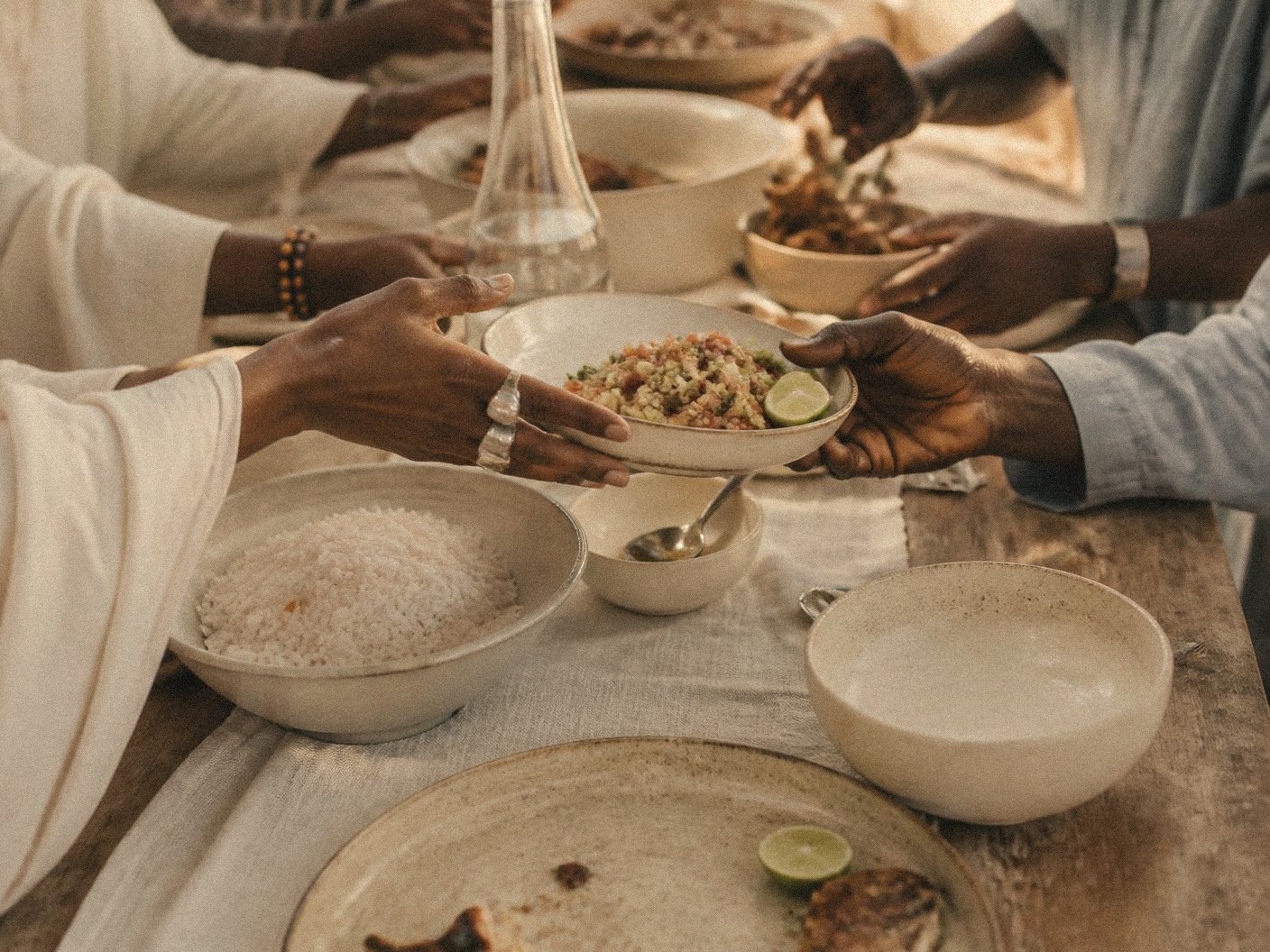 Hands gathered around a creative table